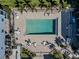 Aerial view of the pool with surrounding patio and lounge seating, great for relaxing and sunbathing at 1750 Jamaica Way # 322, Punta Gorda, FL 33950