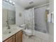Bright, tiled bathroom with updated fixtures, a tub and shower combination, and a modern toilet at 1750 Jamaica Way # 322, Punta Gorda, FL 33950