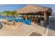 Beach bar with thatch roof offering a relaxing retreat, with seating to soak in the water views at 1750 Jamaica Way # 322, Punta Gorda, FL 33950