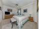Well-lit and cozy bedroom with a television, dresser and art on the wall at 1750 Jamaica Way # 322, Punta Gorda, FL 33950