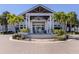 Striking clubhouse with lush landscaping, brick paver drive and elegant entrance at 1750 Jamaica Way # 322, Punta Gorda, FL 33950