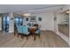 Elegant dining room with stylish chairs, contemporary light fixture, and scenic water view at 1750 Jamaica Way # 322, Punta Gorda, FL 33950