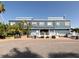 Fishermen's Village: A two story building with palm trees around it, and benches for rest at 1750 Jamaica Way # 322, Punta Gorda, FL 33950