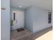 Inviting front door with welcome mat and sidelight window offering a glimpse of the interior at 1750 Jamaica Way # 322, Punta Gorda, FL 33950