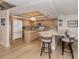 Bright kitchen with granite counters, wood cabinets, kitchen island, and stainless steel appliances at 1750 Jamaica Way # 322, Punta Gorda, FL 33950