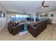 Bright and airy living room with panoramic windows, comfortable seating, and elegant decor at 1750 Jamaica Way # 322, Punta Gorda, FL 33950