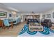 Spacious living room showcasing an open floor plan and seamless transition into the dining area and kitchen at 1750 Jamaica Way # 322, Punta Gorda, FL 33950