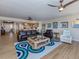 Open living space featuring an island kitchen, modern decor, and comfortable seating at 1750 Jamaica Way # 322, Punta Gorda, FL 33950