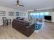 Comfortable living room featuring modern furnishings, a view of the water, and ample natural light at 1750 Jamaica Way # 322, Punta Gorda, FL 33950