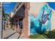 A mural with an ocean theme, including a turtle, decorates the outside of a building at Fishermen's Village at 1750 Jamaica Way # 322, Punta Gorda, FL 33950