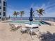 Beautiful waterfront pool featuring resort style furnishings and serene views at 1750 Jamaica Way # 322, Punta Gorda, FL 33950