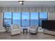 Cozy sitting area with waterfront views, comfortable chairs, and stylish decor at 1750 Jamaica Way # 322, Punta Gorda, FL 33950