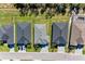 An aerial view of a neighborhood of new construction homes showcasing roof tops and driveways at 1766 Sunset Preserve Way, Port Charlotte, FL 33953