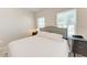Cozy bedroom featuring a comfortable queen-size bed and lots of natural light at 1766 Sunset Preserve Way, Port Charlotte, FL 33953