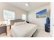 Bright bedroom with a ceiling fan, big windows, and TV above the bed at 1766 Sunset Preserve Way, Port Charlotte, FL 33953