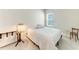 Comfortable bedroom with a queen size bed, side tables and a lamp at 1766 Sunset Preserve Way, Port Charlotte, FL 33953