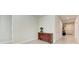 Neutral hallway featuring tiled floors and a traditional wooden table against the wall at 1766 Sunset Preserve Way, Port Charlotte, FL 33953