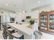Bright kitchen with white cabinets, a large island with seating, and modern appliances at 1766 Sunset Preserve Way, Port Charlotte, FL 33953