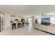 Open floor plan showcases the living room and kitchen, filled with natural light and modern finishes at 1766 Sunset Preserve Way, Port Charlotte, FL 33953