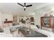 Open-concept living area with a comfy sofa, adjacent to a kitchen, and bright natural light at 1766 Sunset Preserve Way, Port Charlotte, FL 33953