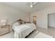 Cozy main bedroom with lots of light from the large window and ceiling fan at 1766 Sunset Preserve Way, Port Charlotte, FL 33953
