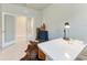 Bright office space with neutral colors, a modern desk, and french doors leading to an additional room at 1766 Sunset Preserve Way, Port Charlotte, FL 33953