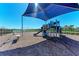 Well-maintained community playground with a variety of play structures, seating, and shade for residents' enjoyment at 1766 Sunset Preserve Way, Port Charlotte, FL 33953