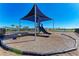 A shaded playground area within a fenced-in community, featuring a slide and climbing ropes at 1766 Sunset Preserve Way, Port Charlotte, FL 33953