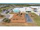 Brightly colored community playground with swings, slides, and climbing structures in a well-maintained area at 1766 Sunset Preserve Way, Port Charlotte, FL 33953