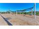 Open-air community playground with swings providing a fun and engaging space for recreation at 1766 Sunset Preserve Way, Port Charlotte, FL 33953