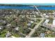 A bird's eye view of a property located in a lush, residential neighborhood at 1769 Manasota Beach Rd, Englewood, FL 34223