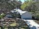 Charming single-Gathering home with mature trees and well-maintained landscaping at 1769 Manasota Beach Rd, Englewood, FL 34223