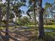 Beautiful backyard with mature trees providing lots of shade at 1769 Manasota Beach Rd, Englewood, FL 34223