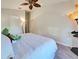 Comfortable bedroom featuring plush carpet, ceiling fan, and neutral paint at 1769 Manasota Beach Rd, Englewood, FL 34223