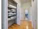 Linen closet with ample shelving; an organized space for storing bedding and linens at 1769 Manasota Beach Rd, Englewood, FL 34223