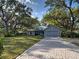 Charming single Gathering home featuring a two car garage and a brick driveway at 1769 Manasota Beach Rd, Englewood, FL 34223
