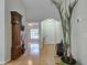 Spacious foyer featuring hardwood floors, high ceilings, and an archway at 1769 Manasota Beach Rd, Englewood, FL 34223