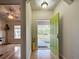 Welcoming foyer with a lime green front door and wood floors at 1769 Manasota Beach Rd, Englewood, FL 34223