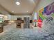 Kitchen with stainless steel appliances, granite countertops, and white cabinets at 1769 Manasota Beach Rd, Englewood, FL 34223