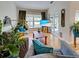 Cozy living room with hardwood floors, comfortable seating, and a view to the exterior patio through sliding doors at 1769 Manasota Beach Rd, Englewood, FL 34223