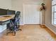 Home office with wood floors, closet, and view to the yard at 1769 Manasota Beach Rd, Englewood, FL 34223