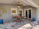 Covered patio with decorative concrete and modern ceiling fan at 1769 Manasota Beach Rd, Englewood, FL 34223