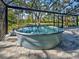Above ground swimming pool with clear water and surrounding landscape at 1769 Manasota Beach Rd, Englewood, FL 34223