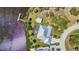 Overhead aerial view of waterfront home with private dock and mature landscaping at 18382 Arapahoe Cir, Port Charlotte, FL 33948