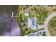 Overhead aerial view of waterfront home with private dock and mature landscaping at 18382 Arapahoe Cir, Port Charlotte, FL 33948