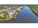Aerial view of a waterfront community along a river showcasing the community's waterfront access at 18382 Arapahoe Cir, Port Charlotte, FL 33948