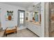 Elegant bathroom featuring double vanity, neutral tiles, and decorative accents at 18382 Arapahoe Cir, Port Charlotte, FL 33948