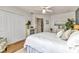 Cozy bedroom showcasing a comfortable bed, ample closet space, and wood flooring at 18382 Arapahoe Cir, Port Charlotte, FL 33948