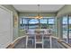 Charming dining area with water view and a modern chandelier at 18382 Arapahoe Cir, Port Charlotte, FL 33948