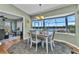 Charming dining area overlooking the water, featuring decorative rug and light fixture at 18382 Arapahoe Cir, Port Charlotte, FL 33948